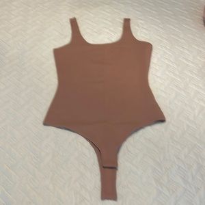 Never worn body suit